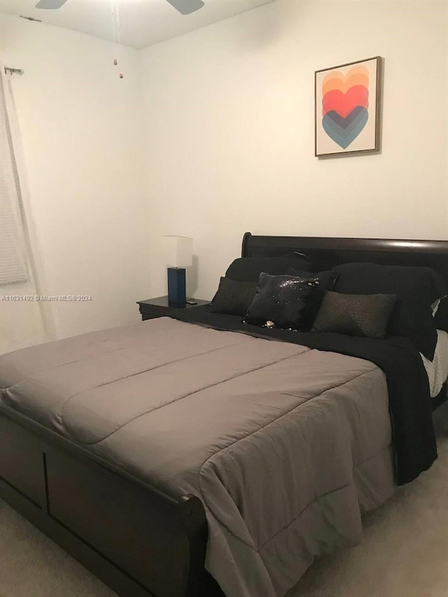 bedroom featuring carpet and ceiling fan