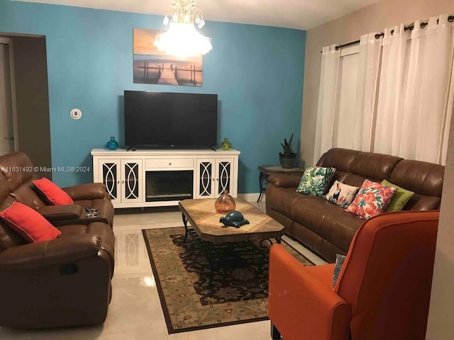 living room with an inviting chandelier and light tile patterned floors