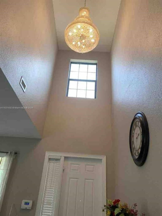 foyer with an inviting chandelier