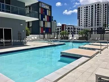 view of pool featuring a hot tub