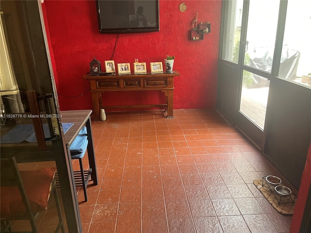 hall featuring tile patterned flooring