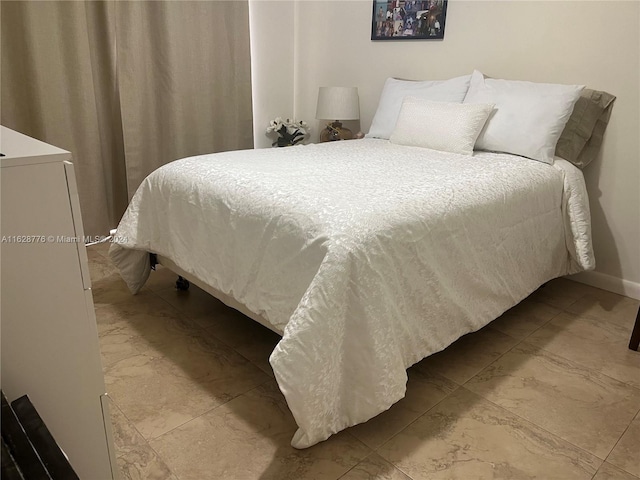 bedroom featuring light tile patterned floors