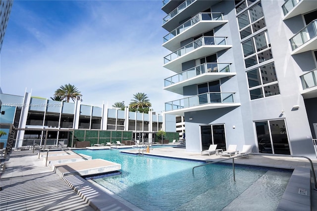 view of pool featuring a patio