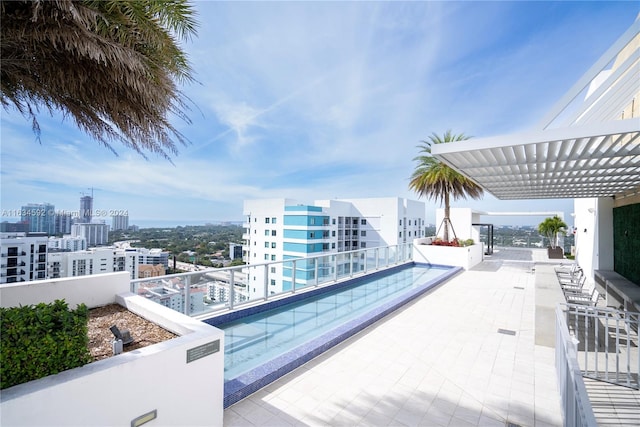 view of swimming pool with a pergola