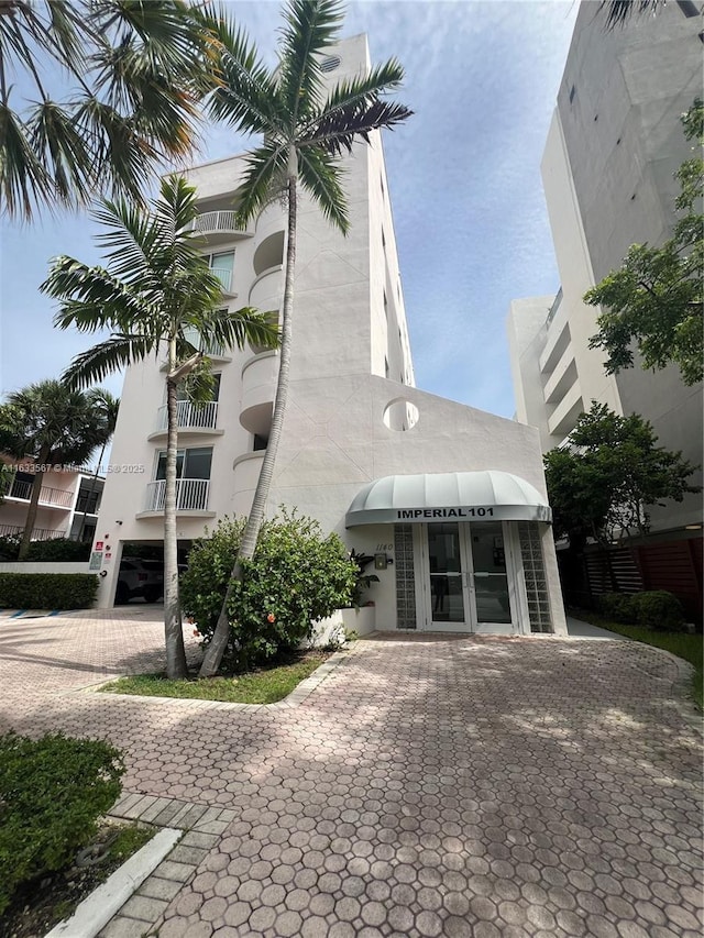 1140 101st St Unit 202-B, Bay Harbor Islands, FL 33154 - view of building exterior featuring driveway