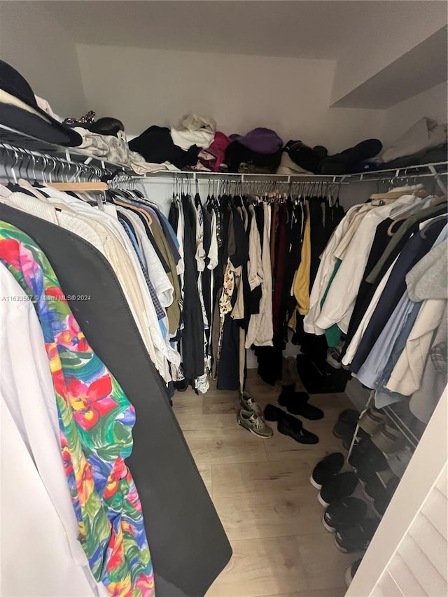 spacious closet with wood finished floors