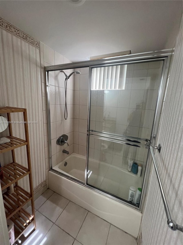 1140 101st St Unit 202-B, Bay Harbor Islands, FL 33154 - bathroom featuring tile patterned flooring and combined bath / shower with glass door