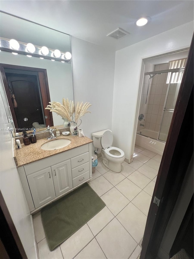 bathroom featuring tile patterned flooring and vanity