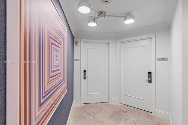 entryway featuring light tile patterned flooring and crown molding