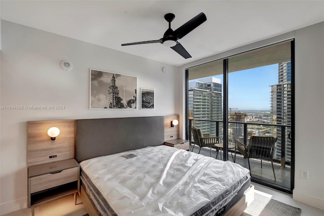 bedroom with ceiling fan, expansive windows, and access to exterior