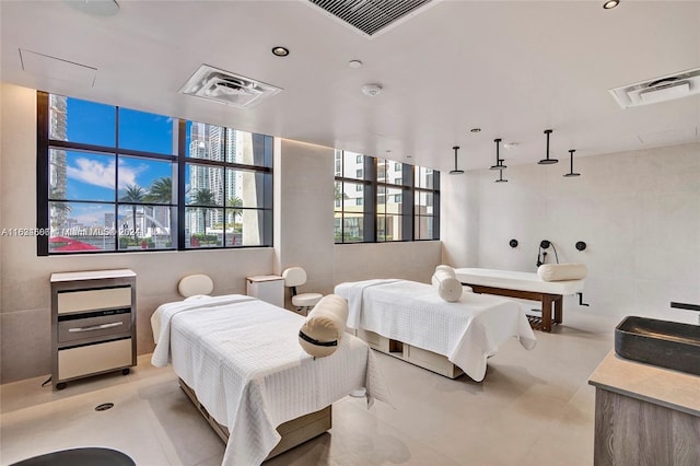 bedroom with tile walls