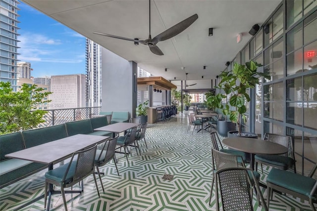 view of patio with ceiling fan and an outdoor living space