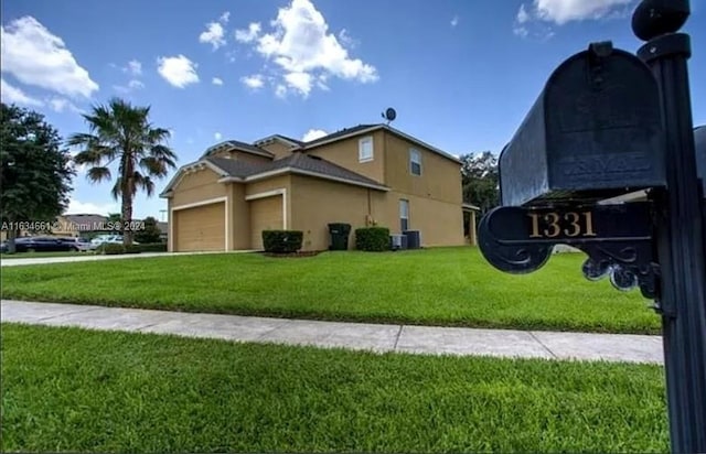 view of front facade featuring a garage and a front yard