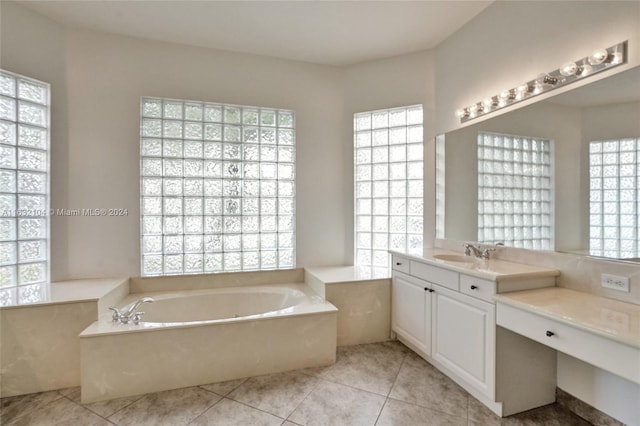 bathroom featuring vanity, a tub, and tile patterned floors