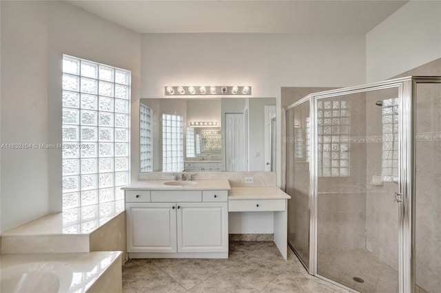 bathroom with vanity, tile patterned flooring, and walk in shower