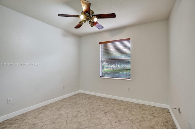 unfurnished room featuring light tile patterned floors and ceiling fan