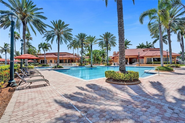 view of swimming pool with a patio area