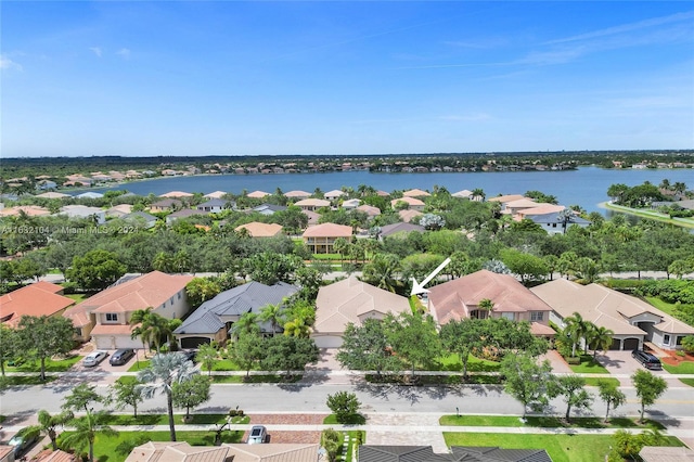 drone / aerial view with a water view