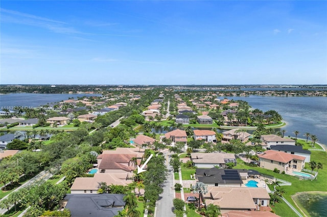 bird's eye view with a water view