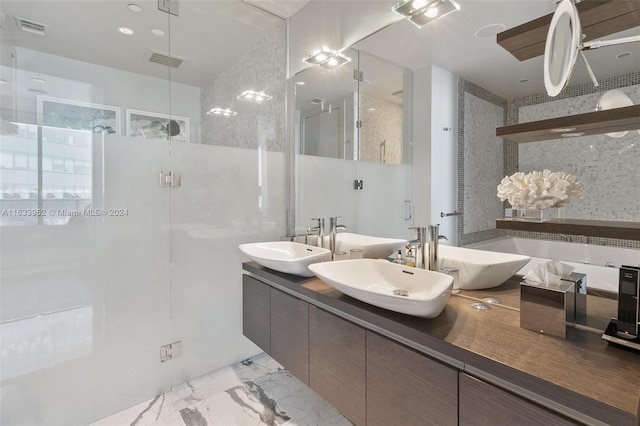 bathroom featuring vanity and a shower with shower door