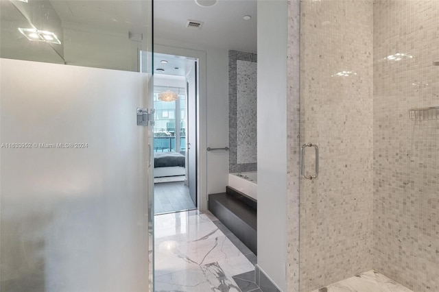 bathroom featuring an enclosed shower and hardwood / wood-style flooring