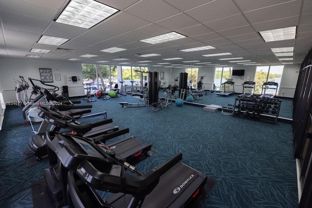 gym with carpet and a drop ceiling