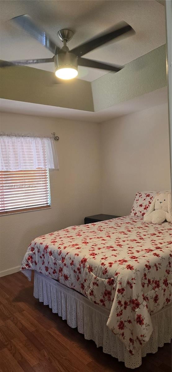 bedroom featuring ceiling fan and dark hardwood / wood-style flooring