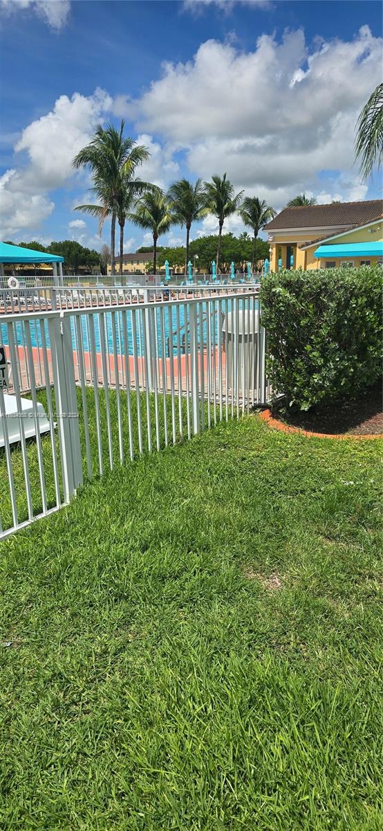 view of yard featuring a community pool