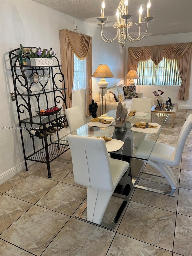 dining space featuring plenty of natural light and a notable chandelier