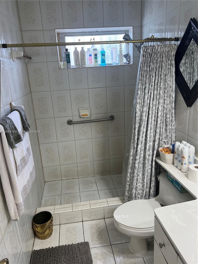 bathroom with a shower with curtain, tile patterned flooring, vanity, and toilet