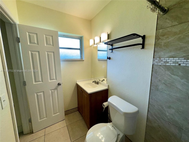 bathroom with vanity, tile patterned flooring, and toilet