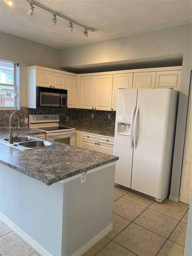 kitchen with white cabinets, sink, white appliances, tasteful backsplash, and a textured ceiling