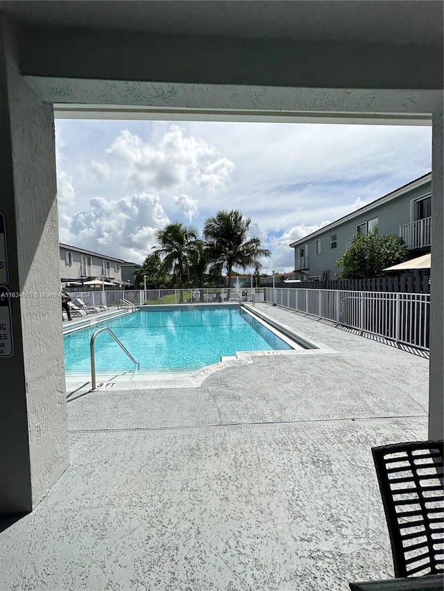 view of swimming pool featuring a patio area