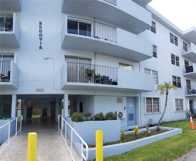 view of building exterior with ac unit