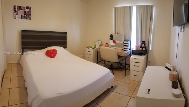 bedroom featuring light tile patterned floors