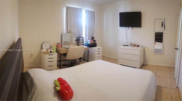 bedroom with light tile patterned flooring