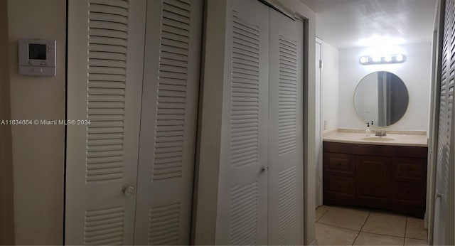 bathroom featuring tile patterned floors and vanity