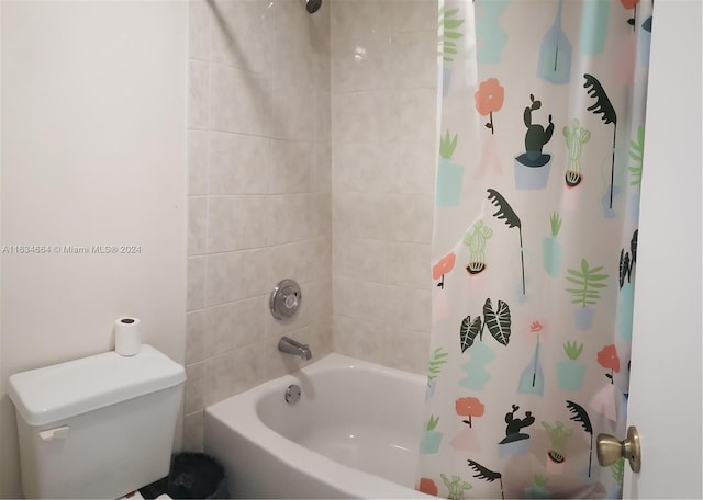 bathroom with shower / bath combination with curtain and toilet