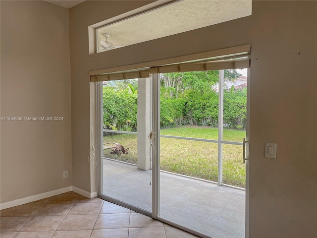 doorway featuring light tile patterned flooring