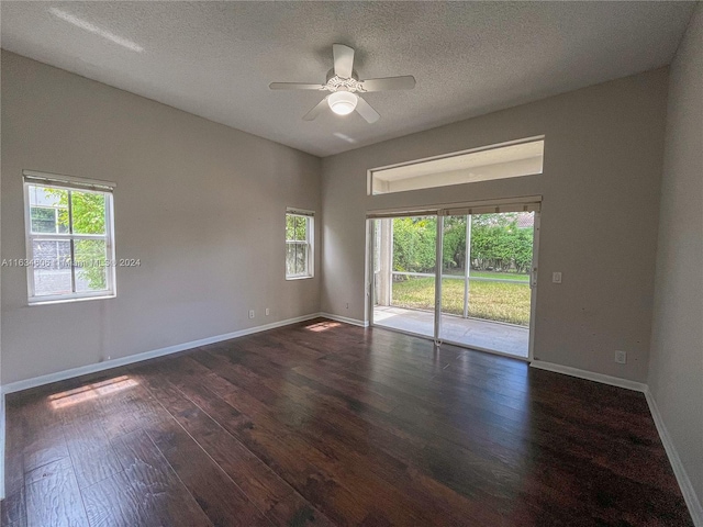 empty room featuring a textured ceiling, ceiling fan, and hardwood / wood-style floors