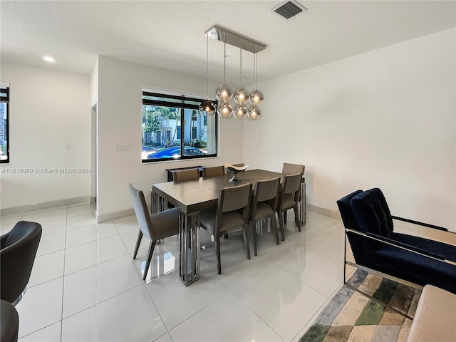 dining area featuring light tile patterned floors