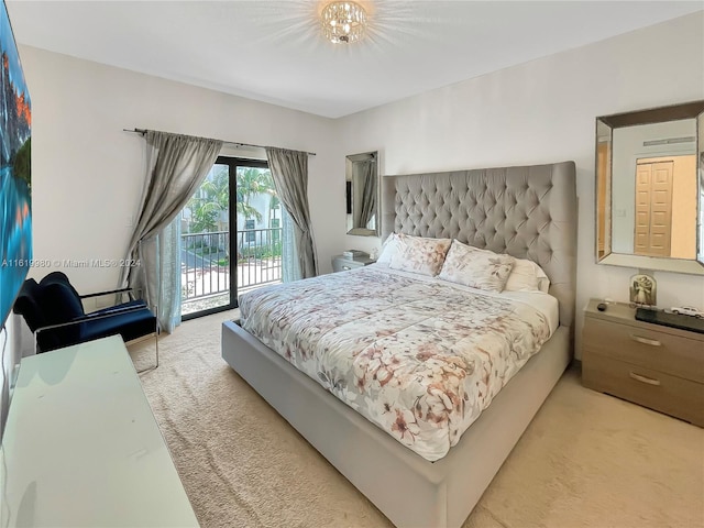 bedroom featuring access to exterior and light carpet