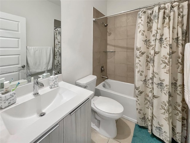 full bathroom with tile patterned flooring, vanity, toilet, and shower / bath combo with shower curtain