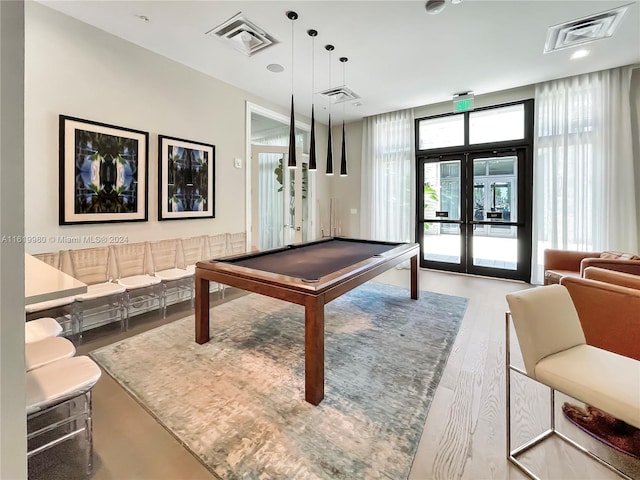 playroom with french doors, billiards, and hardwood / wood-style flooring