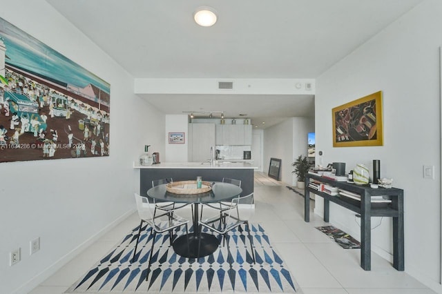 dining room featuring light tile patterned flooring