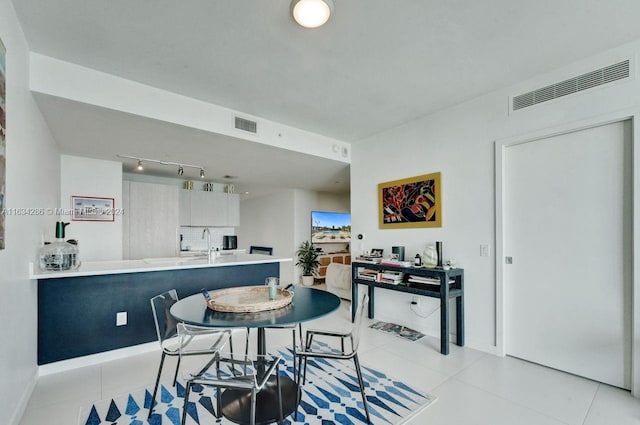 dining area featuring light tile patterned floors