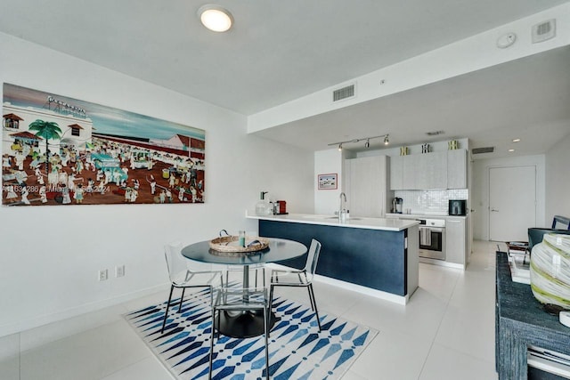 tiled dining space with sink