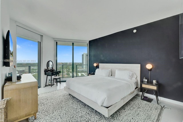 bedroom with floor to ceiling windows