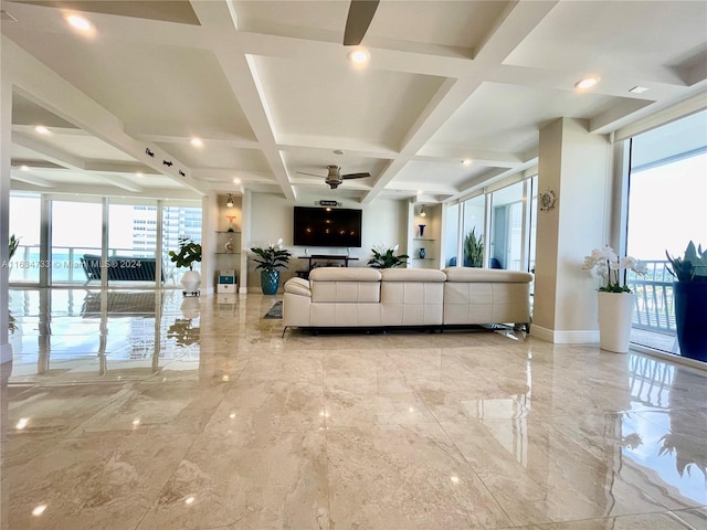 living room with a wall of windows, coffered ceiling, ceiling fan, and beam ceiling