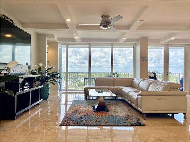 living room featuring a wall of windows, ceiling fan, coffered ceiling, and beam ceiling